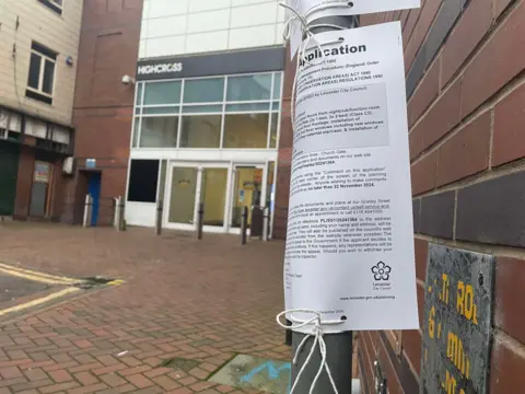 A planning notice strapped to a lamppost near to the entrance to Highcross