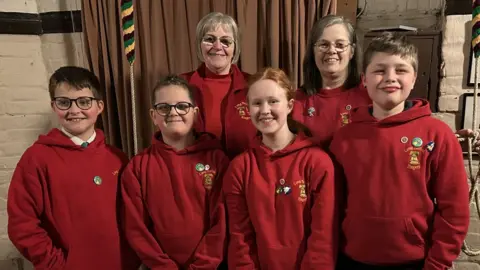 Linda Goodban The four young bell ringers with tutors Linda Goodban and Theresa Munford