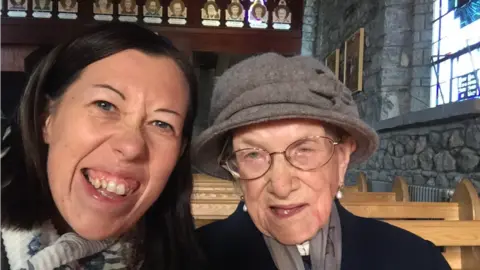 Louise and Nancy in church before the pandemic struck