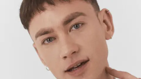 Polydor Olly Alexander looking at the camera