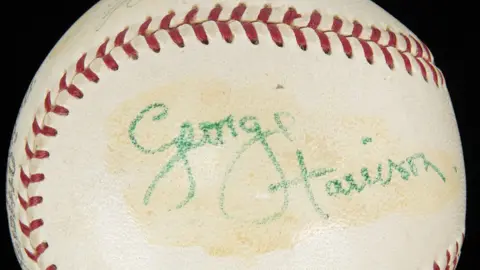 The Beatles Story Baseball signed by George Harrison