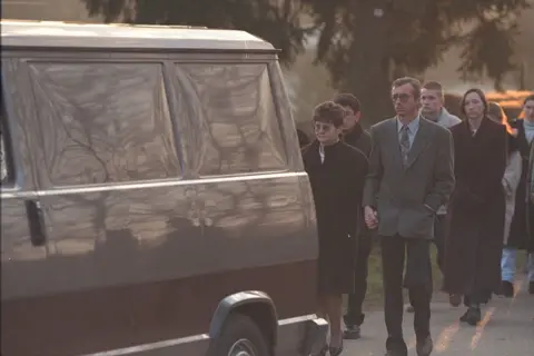 Getty Images Celine Figard's parents are seen following a vehicle during 