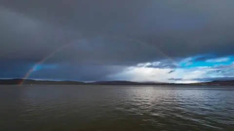 Deborah Mole A rainbow over water in the aftermath of a storm