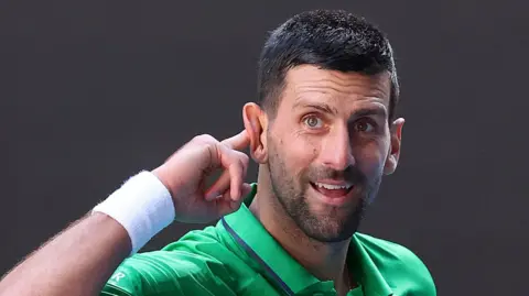 Novak Djokovic jokes with the crowd in a practice session at the 2026 Australian Open