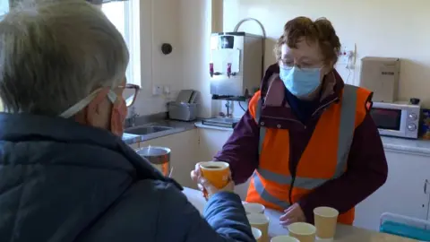 BBC Volunteer serving coffee