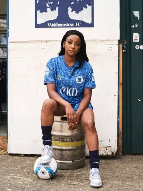 Jake Green A model wears the home shirt outside Walthamstow FC