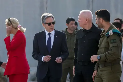 Getty Images Gallant speaking with US Secretary of State Antony Blinken at the Kerem Shalom crossing between Israel and Gaza earlier this month