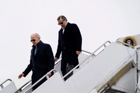 Reuters Joe Biden and Hunter Biden deplane from Air Force One in 2023