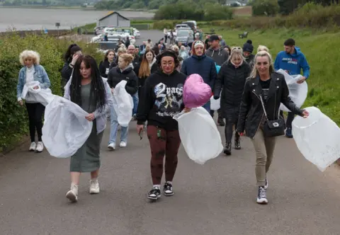 Pacemaker Kathryn Patron vigil friends walking carrying lanterns