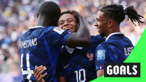 Kylian Mbappe celebrates with Dayot Upamecano and Michael Olise