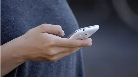 Getty Images Woman on phone