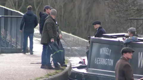 Richard Lewis Cillian Murphy on a narrowboat on set for Peaky Blinders in Wrexham