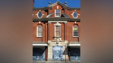 Supplied A red brick building. 