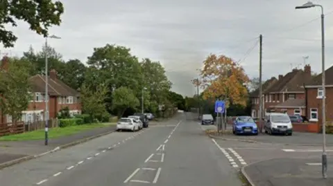 Google A google maps street view image of Marston Lane in Bedwoth with the road stretching into the distance. Cars are parked on the side of the road.