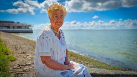 Maureen Roose sitting on the sea wall at Westcliff-on-Sea