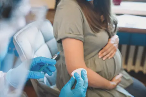 Getty Images pregnant woman getting vaccine