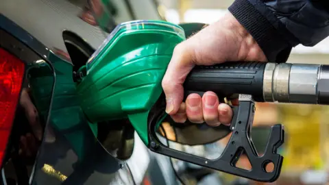 Car being filled with petrol pump