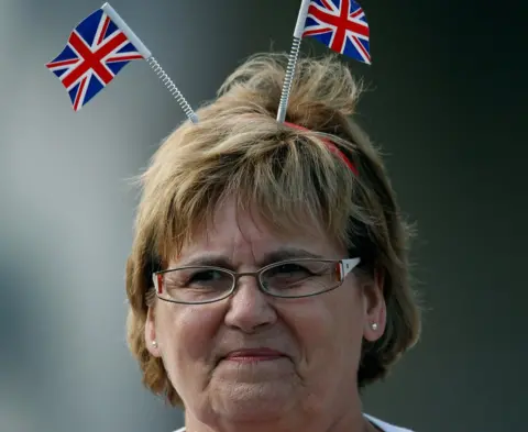 Getty Images A member of the public gets an early vantage point to view the procession and the Royal wedding of Zara Phillips and Mike Tindall at The Palace of Holyroodhouse on July 30, 2011