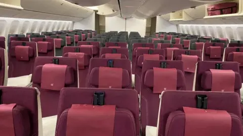 SABRINA TIASHA/ FACEBOOK An empty Qatar Airways flight heading to Sydney