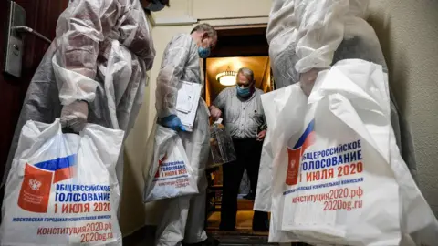 AFP A voter casts a ballot into a mobile ballot box during the early vote on 29 June