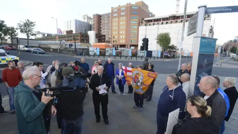 Pacemaker Campaigner Billy Dixon (centre) addressed protestors near the bridge on Tuesday evening