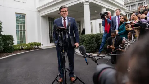 Getty Images Republican House Speaker Mike Johnson speaks to reporters outside the White House following Tuesday's meeting