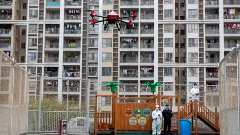 XAG flying a drone over a kids park