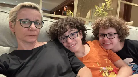 Ms Argenau Ms Argenau with her children