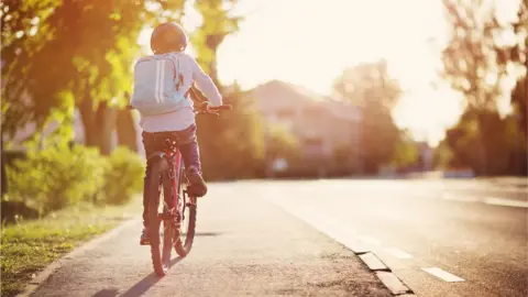 Getty Images Boy on bike