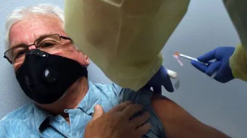 Getty Images Trial participant receiving the Moderna vaccine