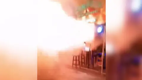 A still from a video showing a fireball shooting out of the venue