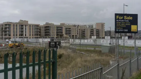 Getty Images A construction site for a mixed-use development in Dublin, Ireland. A for sale sign is at the forefront