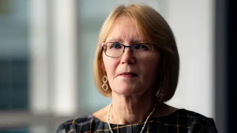 PA Media Teresa Medhurst, a woman with light coloured hair and glasses. She is wearing a