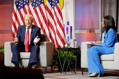 Getty Images Former President Donald Trump on stage with ABC News correspondent Rachel Scott