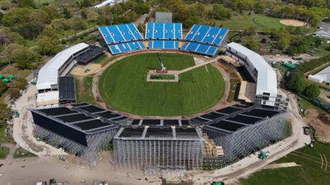 Drop-in pitches are lowered into the 34,000-seat stadium in Eisenhower Park in Nassau County