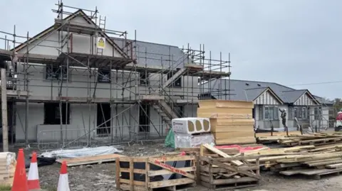Scaffolding around a house that is being built