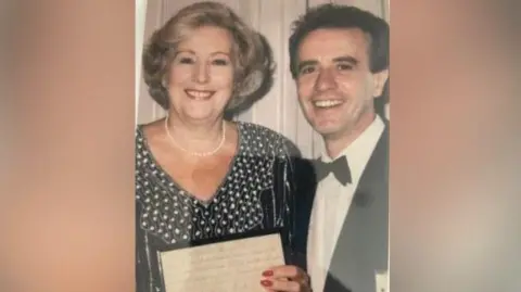 Reg Martin Reg Martin posing for a picture with Dame Very Lynn when she awarded him for best article in The Magic Circle's magazine in the 1990s. Dame Vera is holding the award. They are both smiling.