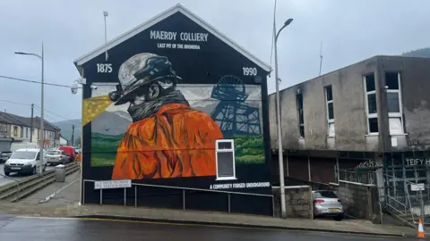 Mural showing miner at colliery