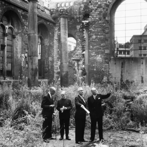 Getty Images Black and white image (L-R) Architect Patrick Horsebrugh, Canon C B Mortlock, Dr Robert Davidson and Marshall Sisson standing in dark suits in the middle of the ruins of St Mary Aldermanbury in London in July 1964