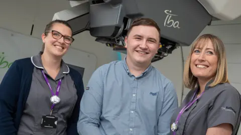 Huw John, Cardiff Ryan, pictured with radiographers Kate Leaver and Kerry Owen