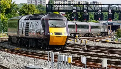 Bryan Ellis A High Speed Train passing under signals