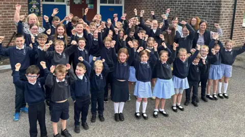 Pupils outside school building