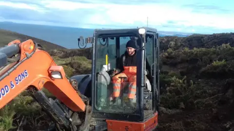 Jake Crocker Jake Crocker in a digger