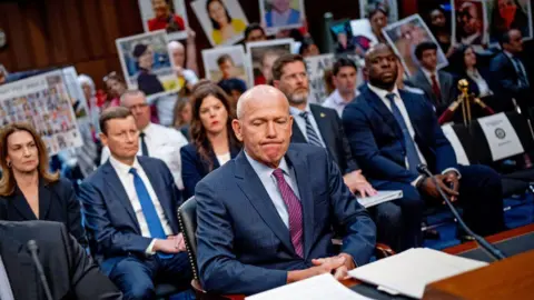 Getty Images Family members of those killed in the Ethiopian Airlines Flight 302 and Lion Air Flight 610 crashes hold photographs of their loved ones as Boeing CEO Dave Calhoun arrives for a Senate Homeland Security and Governmental Affairs Investigations Subcommittee hearing on Boeing's broken safety culture on Capitol Hill on June 18, 2024 in Washington, DC 