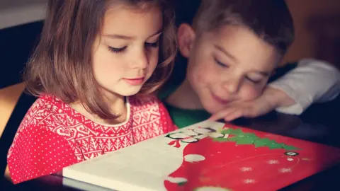 Getty Images children looking at advent calendar