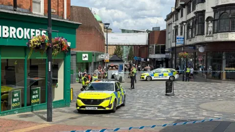 Police cordon outside pawnbrokers shop