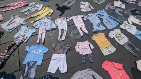 Image of children's clothes placed on the ground