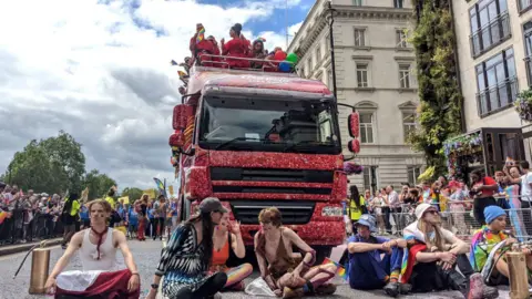 PA Media Just Stop Oil protesters briefly halted the parade after sitting down in front of a float at Piccadilly's junction with Down Street