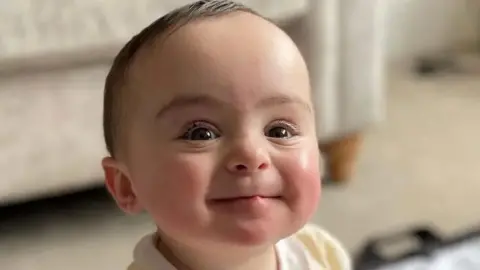 Family handout Close up of the smiling face of nine-month-old Genevieve Meehan