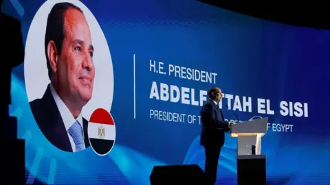 Reuters Egyptian President Abdul Fattah al-Sisi speaks during the opening session of the COP27 climate summit, in Sharm el-Sheikh, Egypt (7 November 2022)